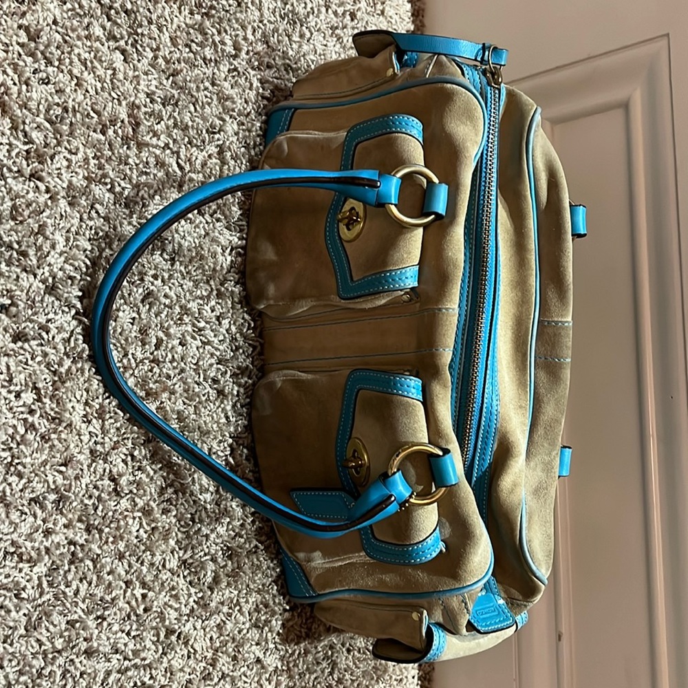Showstopping, beige, suede, and turquoise leather coach bag